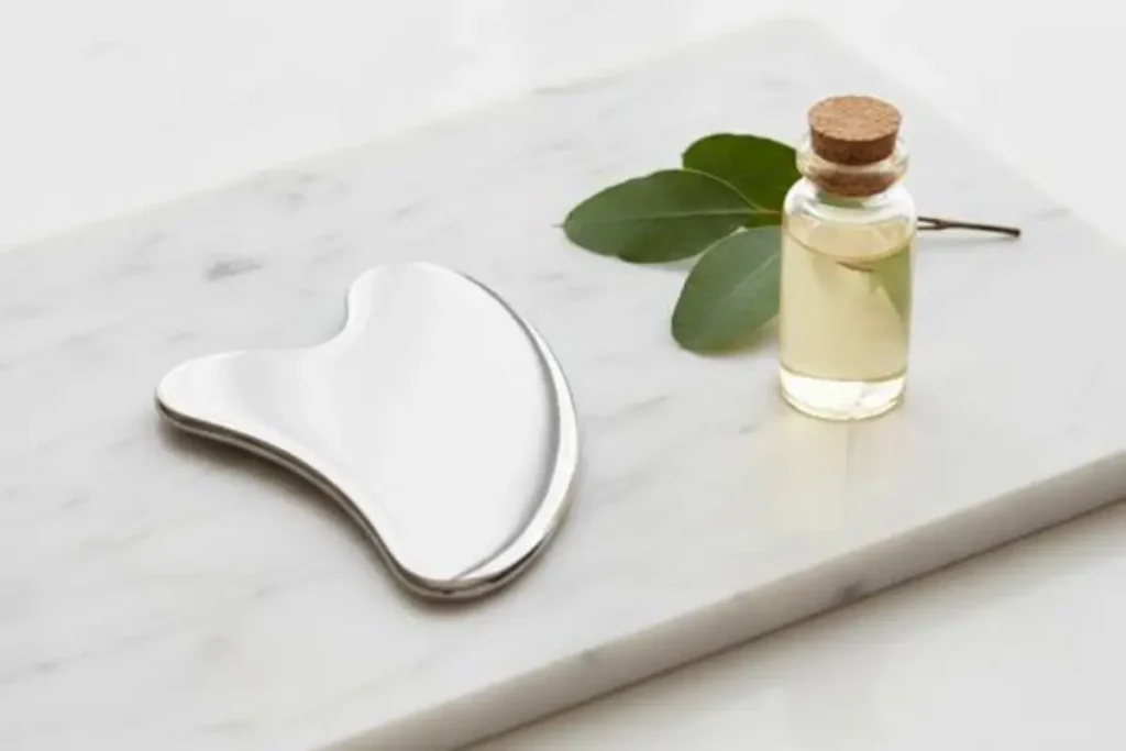 Massageador facial manual em aço inoxidável